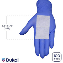 A hand with a blue glove on it holding MedPlus Dukal Alcohol Prep Pads - Large (BOX of 100) for disinfection.