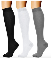 Three pairs of Caring Compression Socks (3 Pairs) 15-20 mmHg (LARGE-X-LARGE) made from breathable fabric, offering optimal support by Amazon.